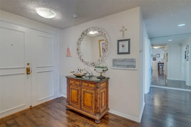a view of an entryway with wooden floor