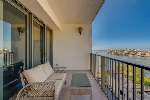 a living room with furniture couch and a chandelier