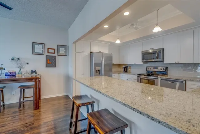 a large kitchen with cabinets