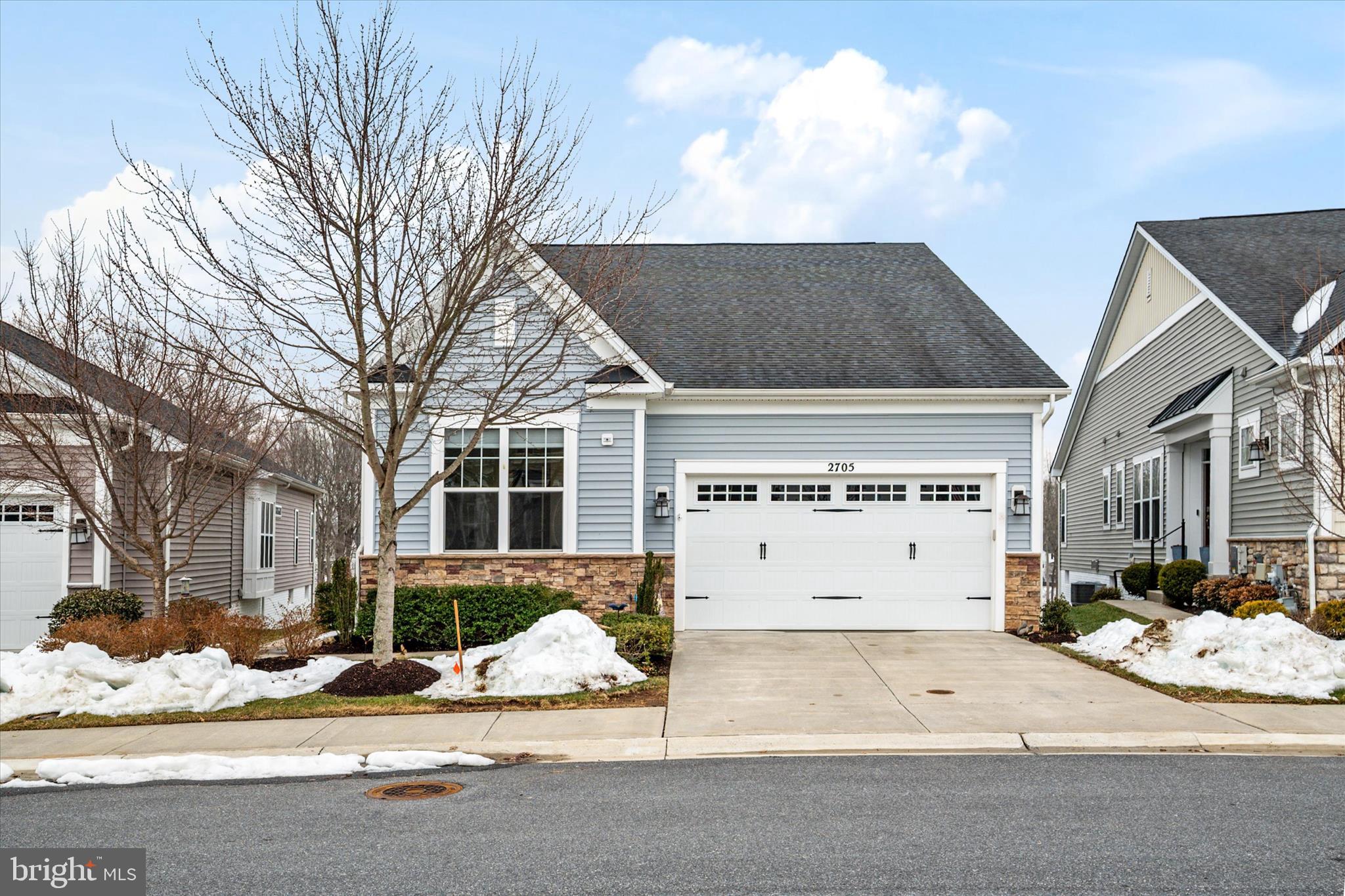 2705 Dragon Fly Way Odenton, MD 21113 - Photo 1 of 79 a front view of a house with a yard and garage