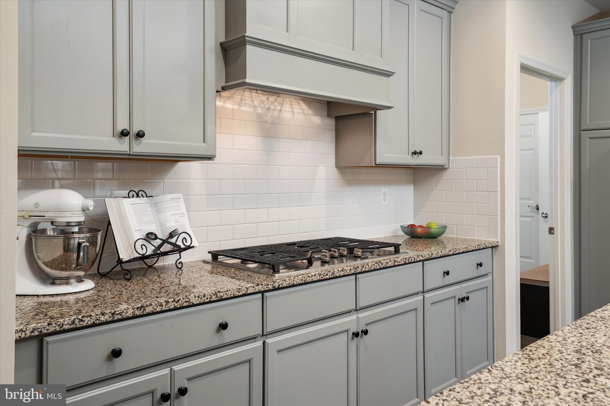2705 Dragon Fly Way Odenton, MD 21113 - Photo 19 of 79 a kitchen with granite countertop cabinets and stove