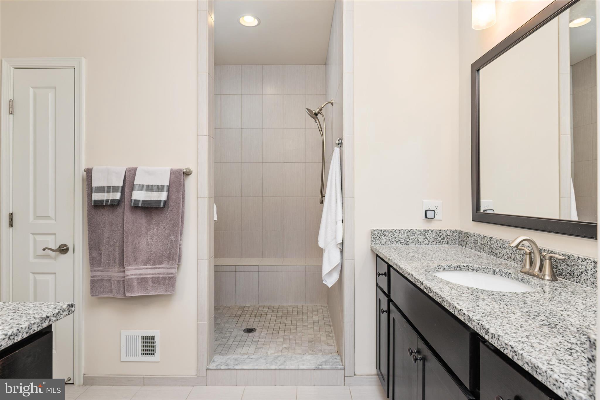 2705 Dragon Fly Way Odenton, MD 21113 - Photo 26 of 79 a bathroom with a granite countertop sink and a mirror