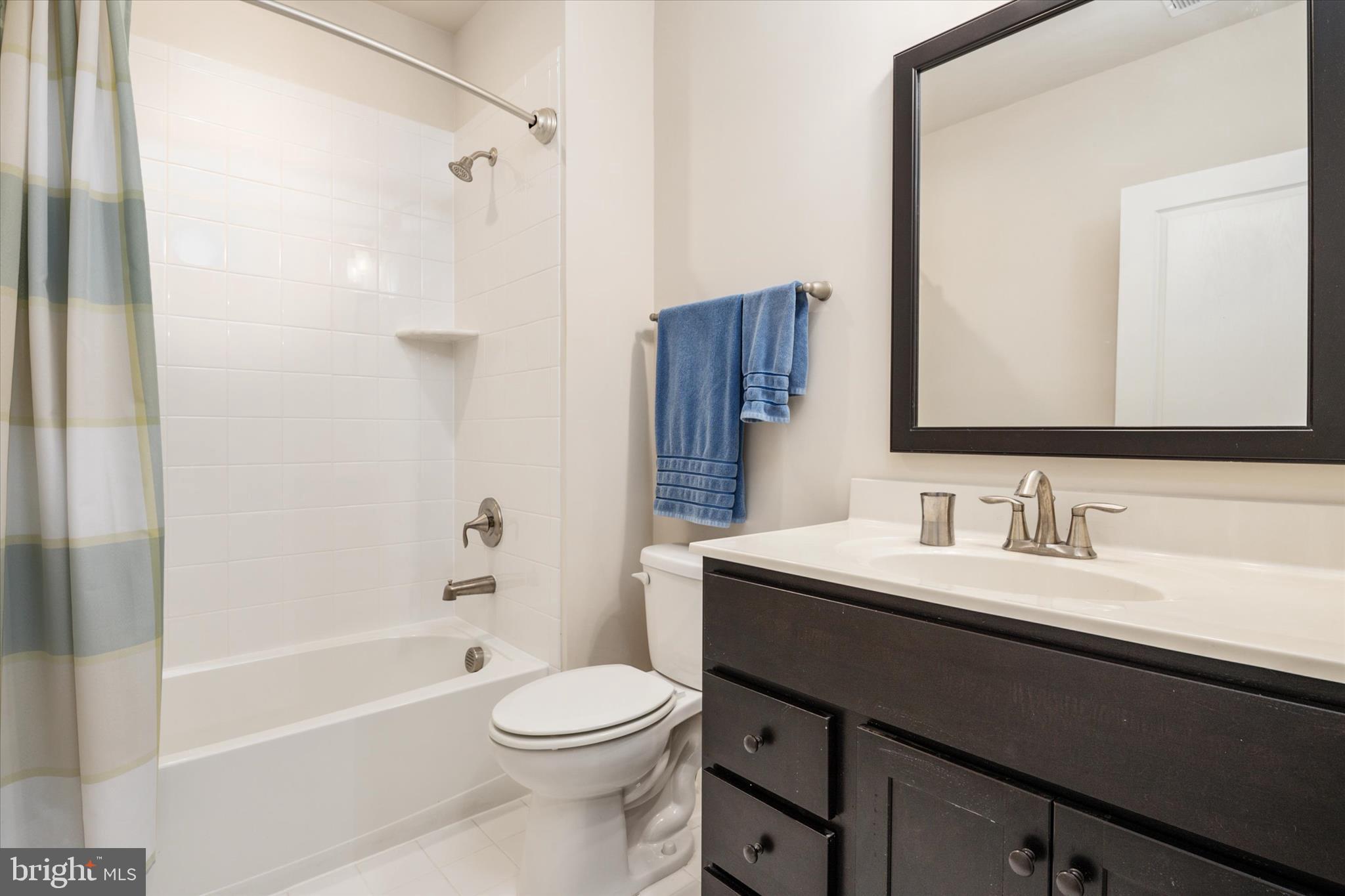 2705 Dragon Fly Way Odenton, MD 21113 - Photo 42 of 79 a bathroom with a sink a toilet and shower