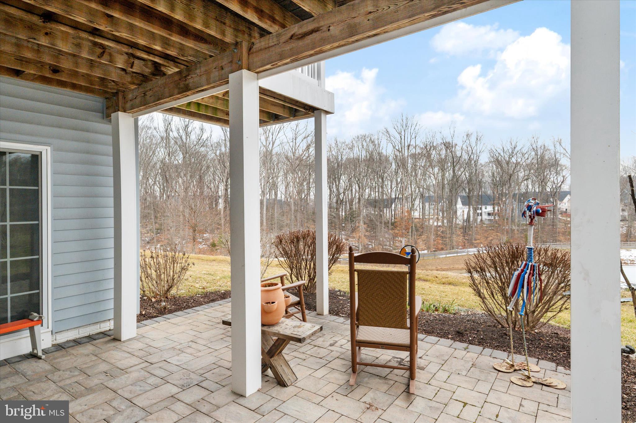 2705 Dragon Fly Way Odenton, MD 21113 - Photo 55 of 79 a view of a balcony with chair and table in the patio