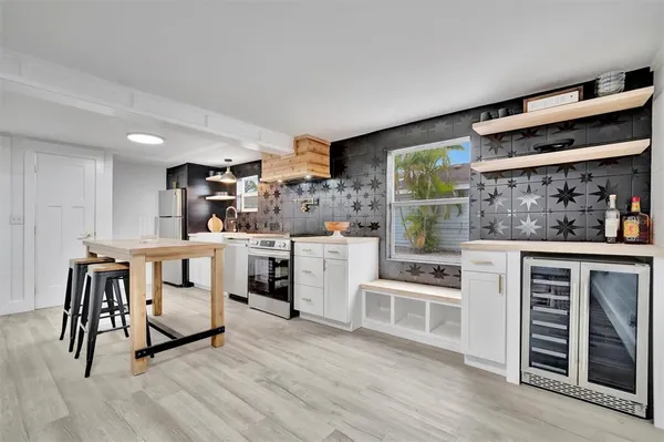 a view of a chair and table on the wooden floor
