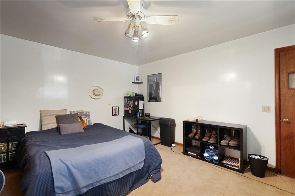 1340 Hyden Tyler Road Chatsworth, GA 30705 - Photo 17 of 65 a bedroom with a bed and a tv