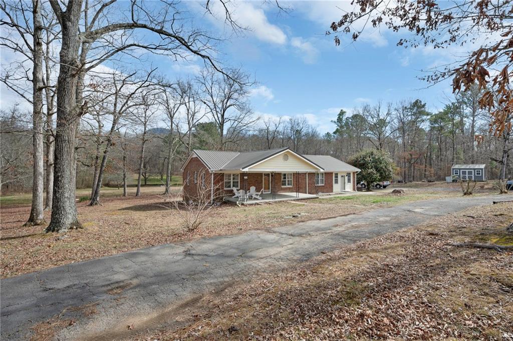 1340 Hyden Tyler Road Chatsworth, GA 30705 - Photo 2 of 65 a view of a house with a yard covered in snow