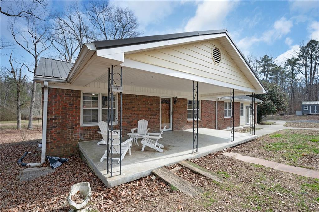 1340 Hyden Tyler Road Chatsworth, GA 30705 - Photo 3 of 65 a view of a house with backyard porch and sitting area