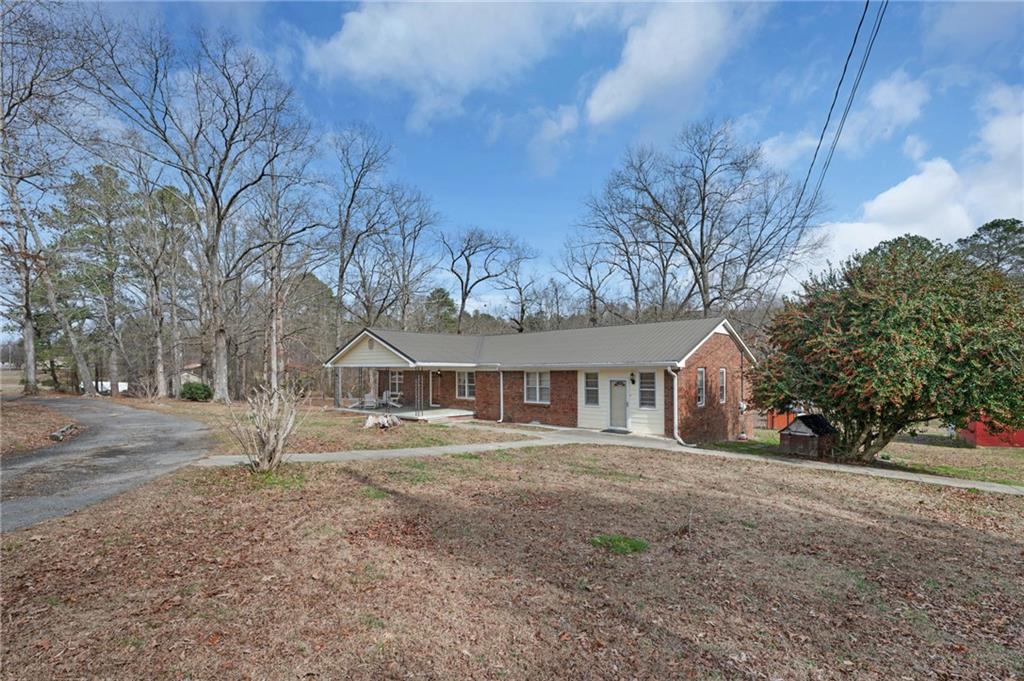 1340 Hyden Tyler Road Chatsworth, GA 30705 - Photo 31 of 65 a front view of a house with a yard