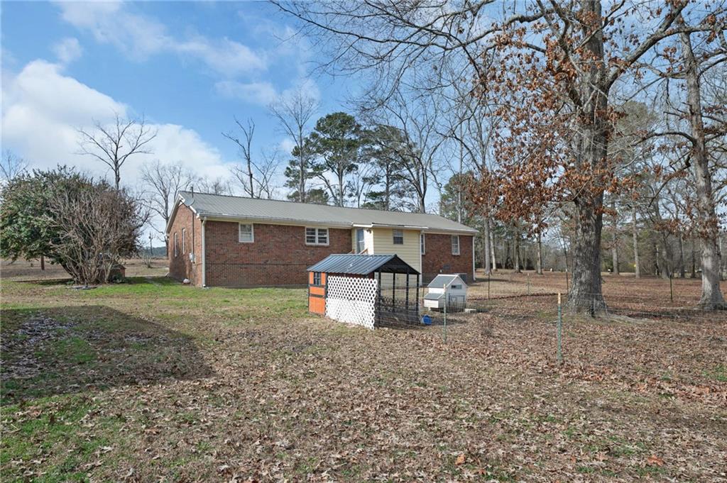 1340 Hyden Tyler Road Chatsworth, GA 30705 - Photo 35 of 65 a front view of a house with garden