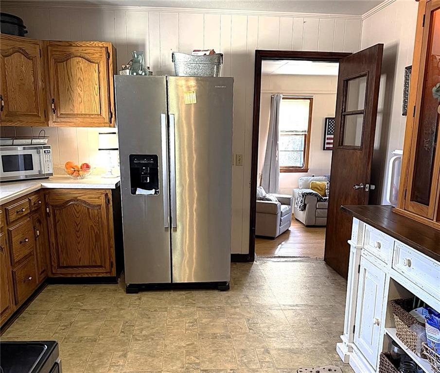 1340 Hyden Tyler Road Chatsworth, GA 30705 - Photo 52 of 65 a kitchen with stainless steel appliances a refrigerator a sink a stove and cabinets