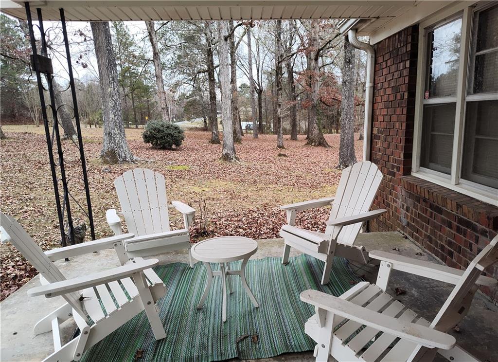 1340 Hyden Tyler Road Chatsworth, GA 30705 - Photo 65 of 65 a view of balcony with furniture and wooden fence