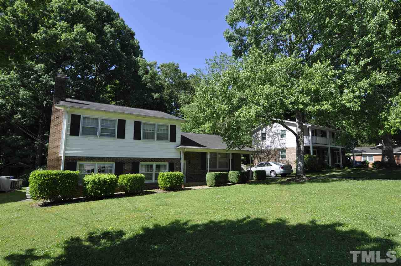 532 Princeton Street Raleigh, NC 27609 - Photo 1 of 19 a front view of a house with a garden and trees