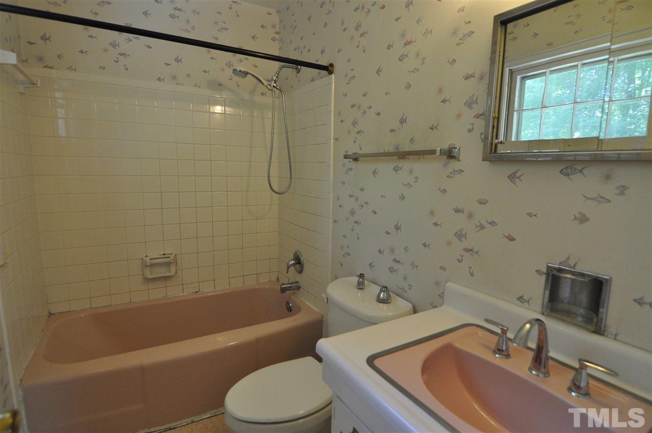 532 Princeton Street Raleigh, NC 27609 - Photo 15 of 19 a bathroom with a sink toilet and shower