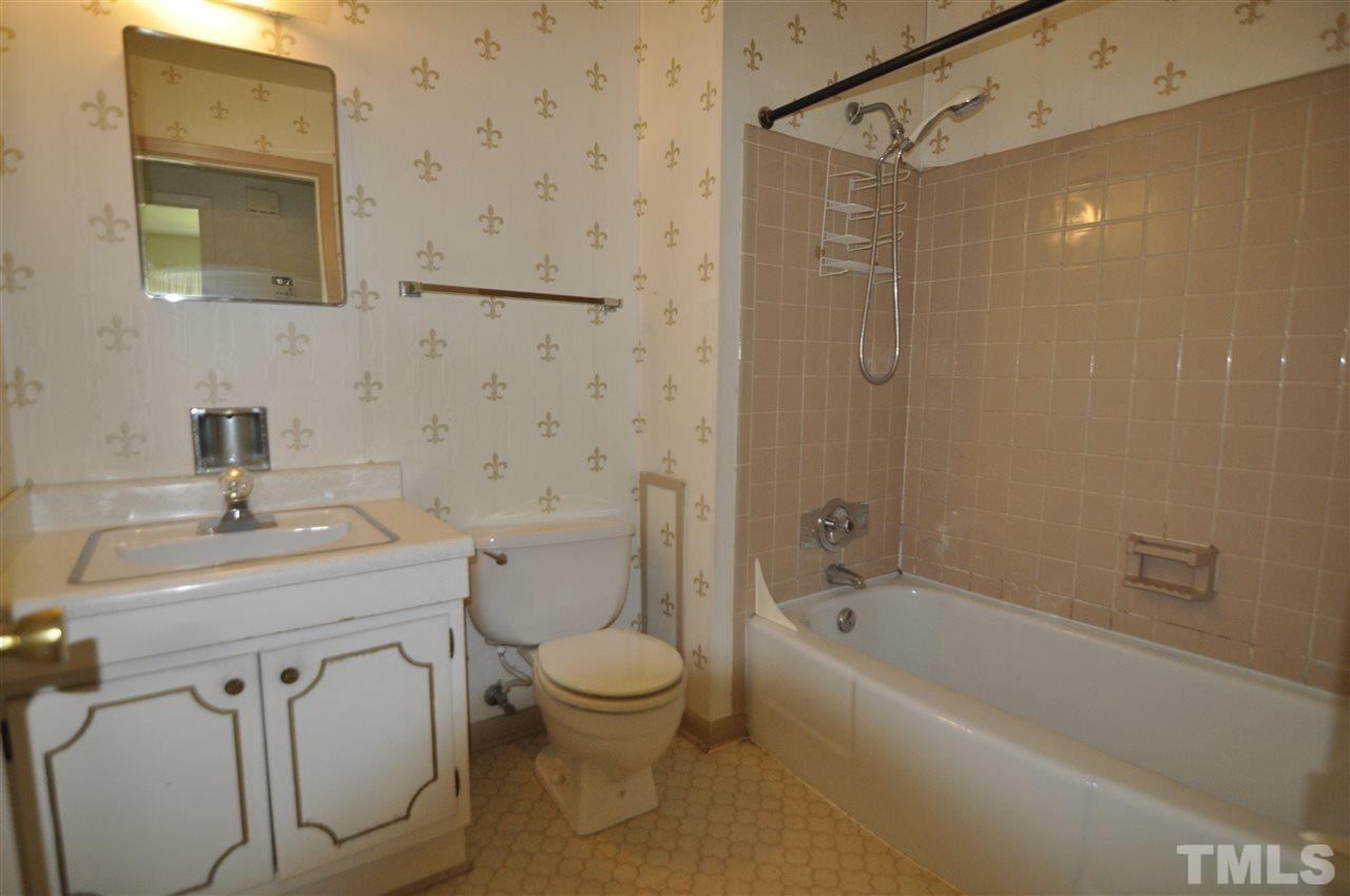 532 Princeton Street Raleigh, NC 27609 - Photo 18 of 19 a bathroom with a sink toilet and shower