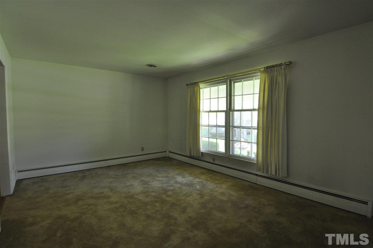 532 Princeton Street Raleigh, NC 27609 - Photo 6 of 19 an empty room with a empty space and windows