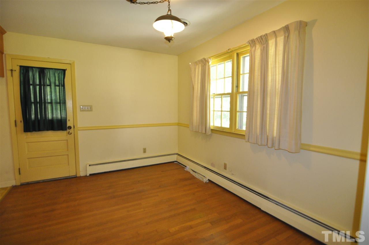 532 Princeton Street Raleigh, NC 27609 - Photo 9 of 19 an empty room with windows