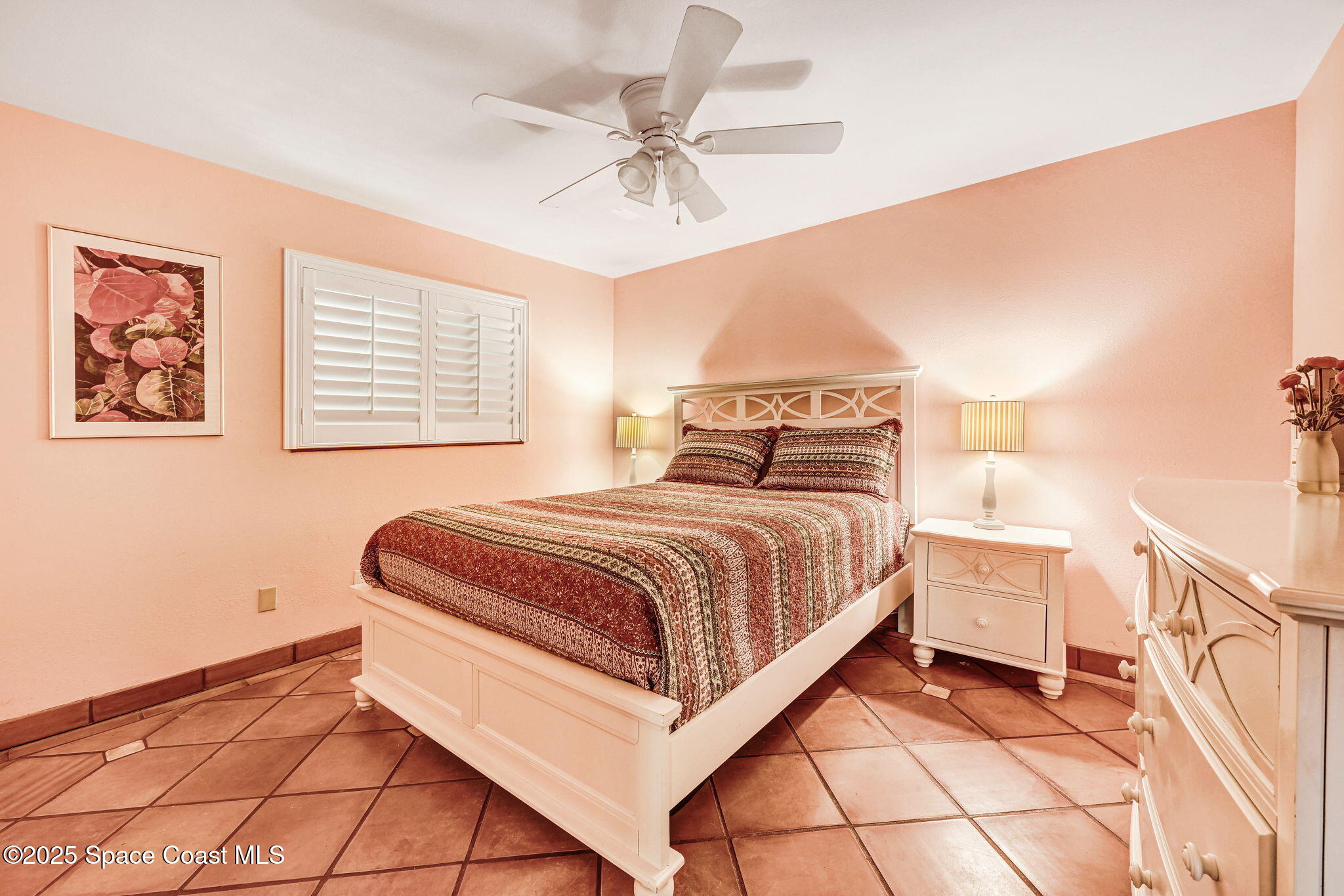 312 Wave Crest Avenue Indialantic, FL 32903 - Photo 12 of 62 a bedroom with a bed and a ceiling fan