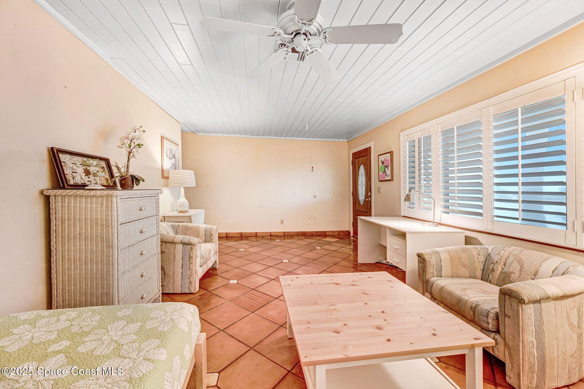 312 Wave Crest Avenue Indialantic, FL 32903 - Photo 15 of 62 a living room with a couch