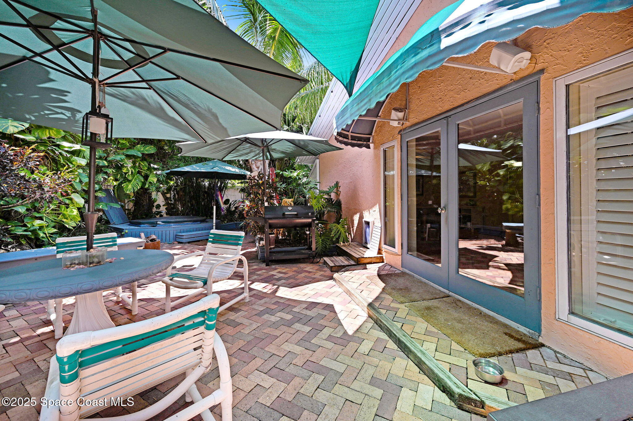 312 Wave Crest Avenue Indialantic, FL 32903 - Photo 18 of 62 a view of backyard with a patio
