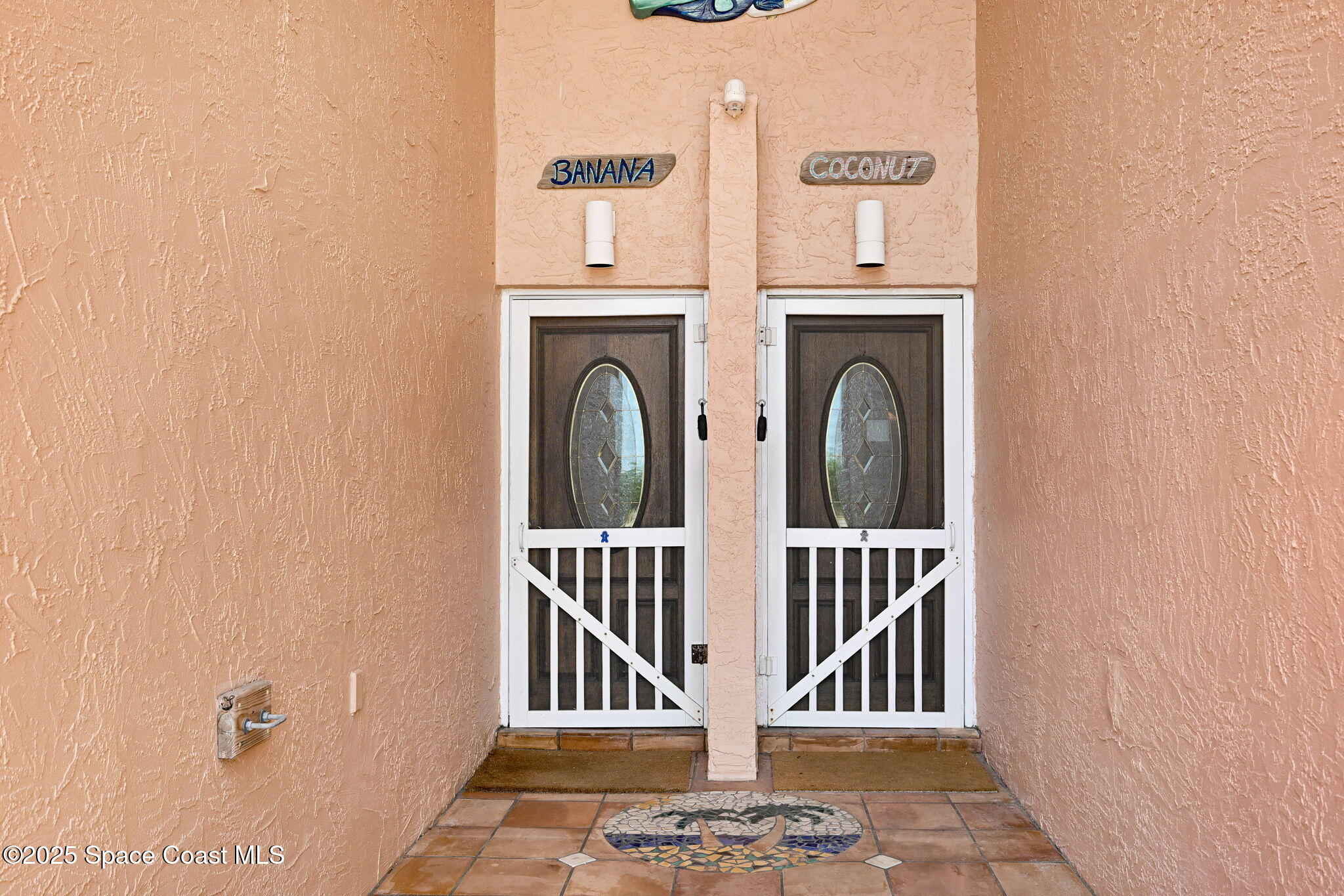 312 Wave Crest Avenue Indialantic, FL 32903 - Photo 24 of 62 a view of entryway with wooden floor