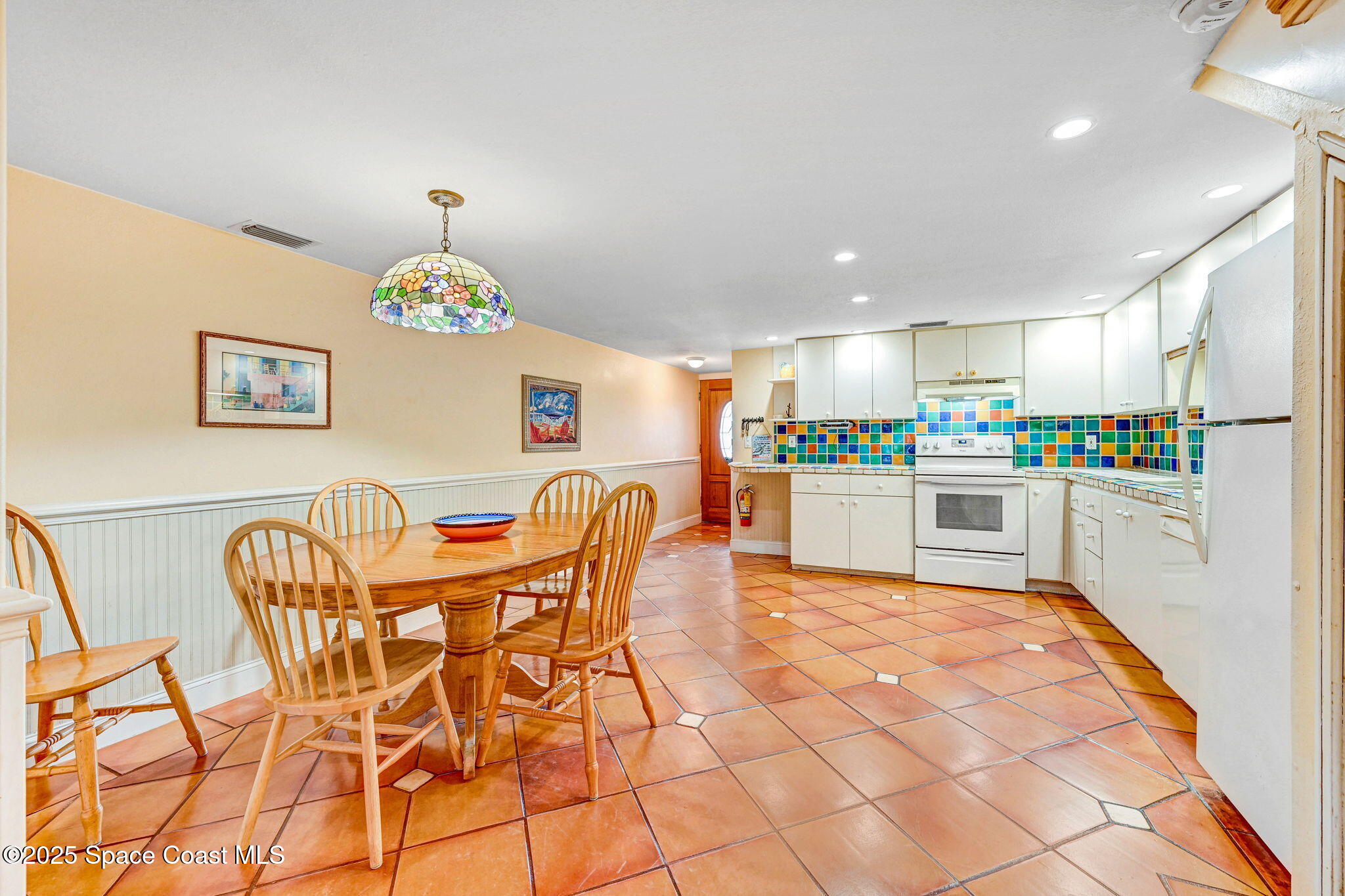 312 Wave Crest Avenue Indialantic, FL 32903 - Photo 26 of 62 a kitchen with granite countertop cabinets and stainless steel appliances