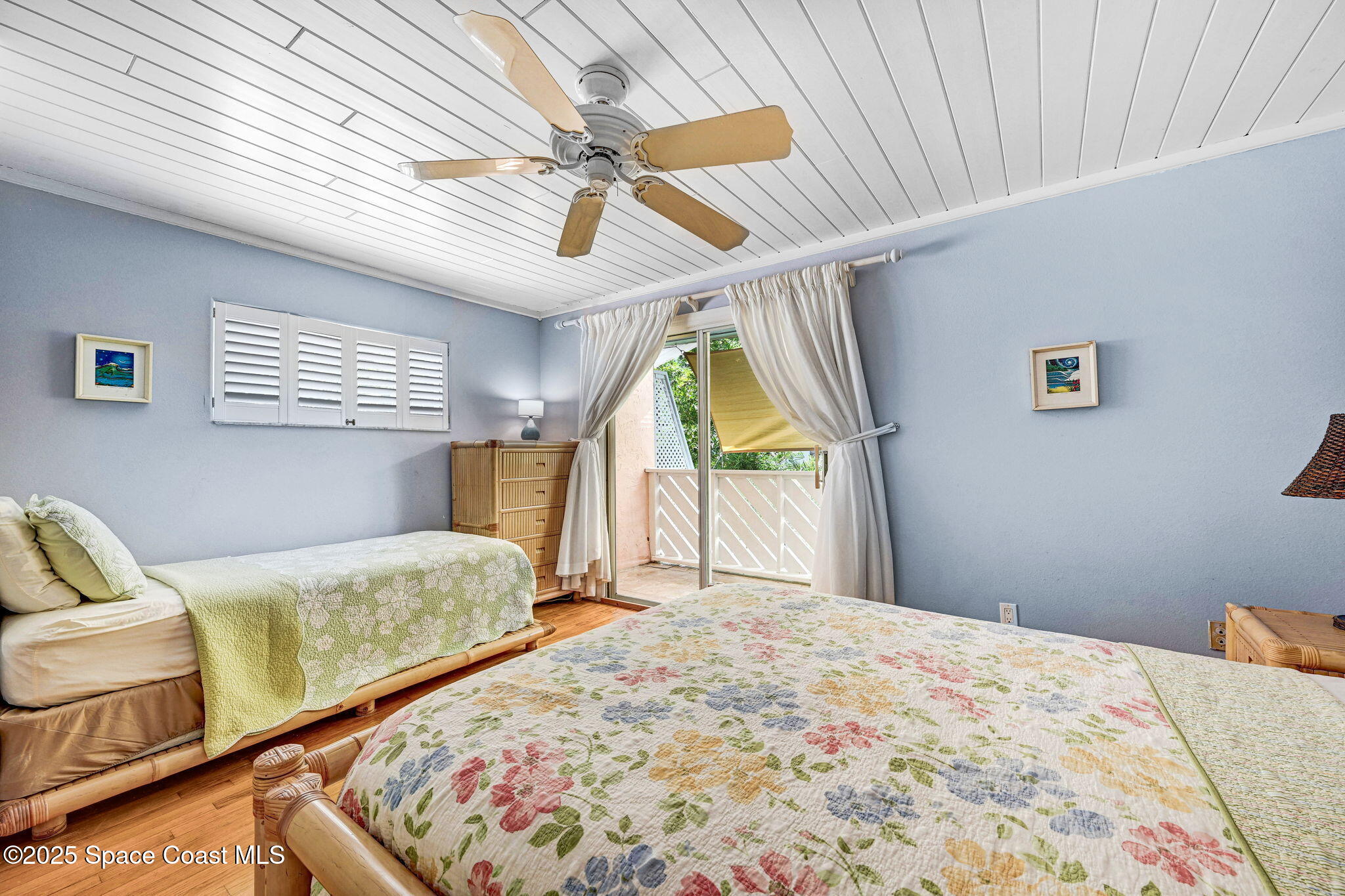 312 Wave Crest Avenue Indialantic, FL 32903 - Photo 32 of 62 a bedroom with a bed next to a window with the outer view