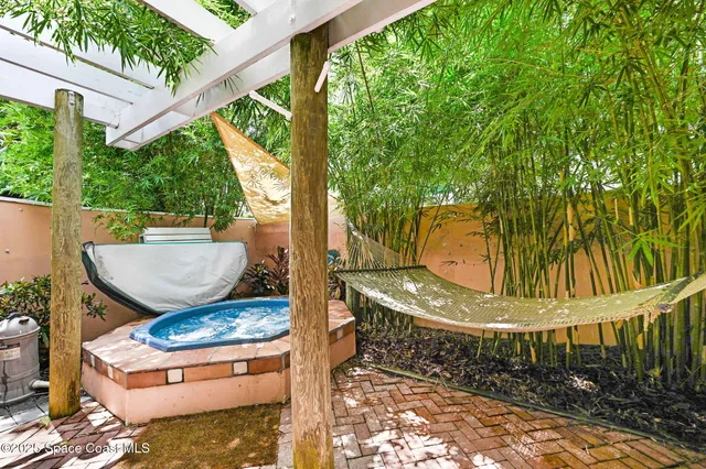 a bedroom with a bed couch and window