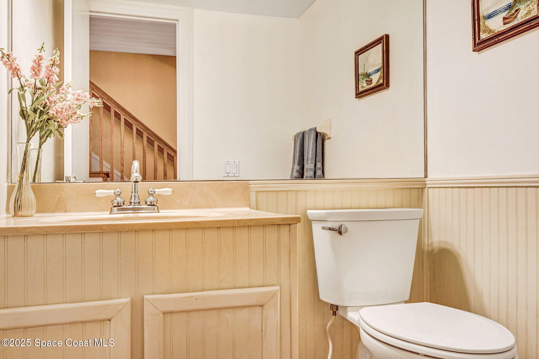 312 Wave Crest Avenue Indialantic, FL 32903 - Photo 39 of 62 a bathroom with a sink a toilet and mirror