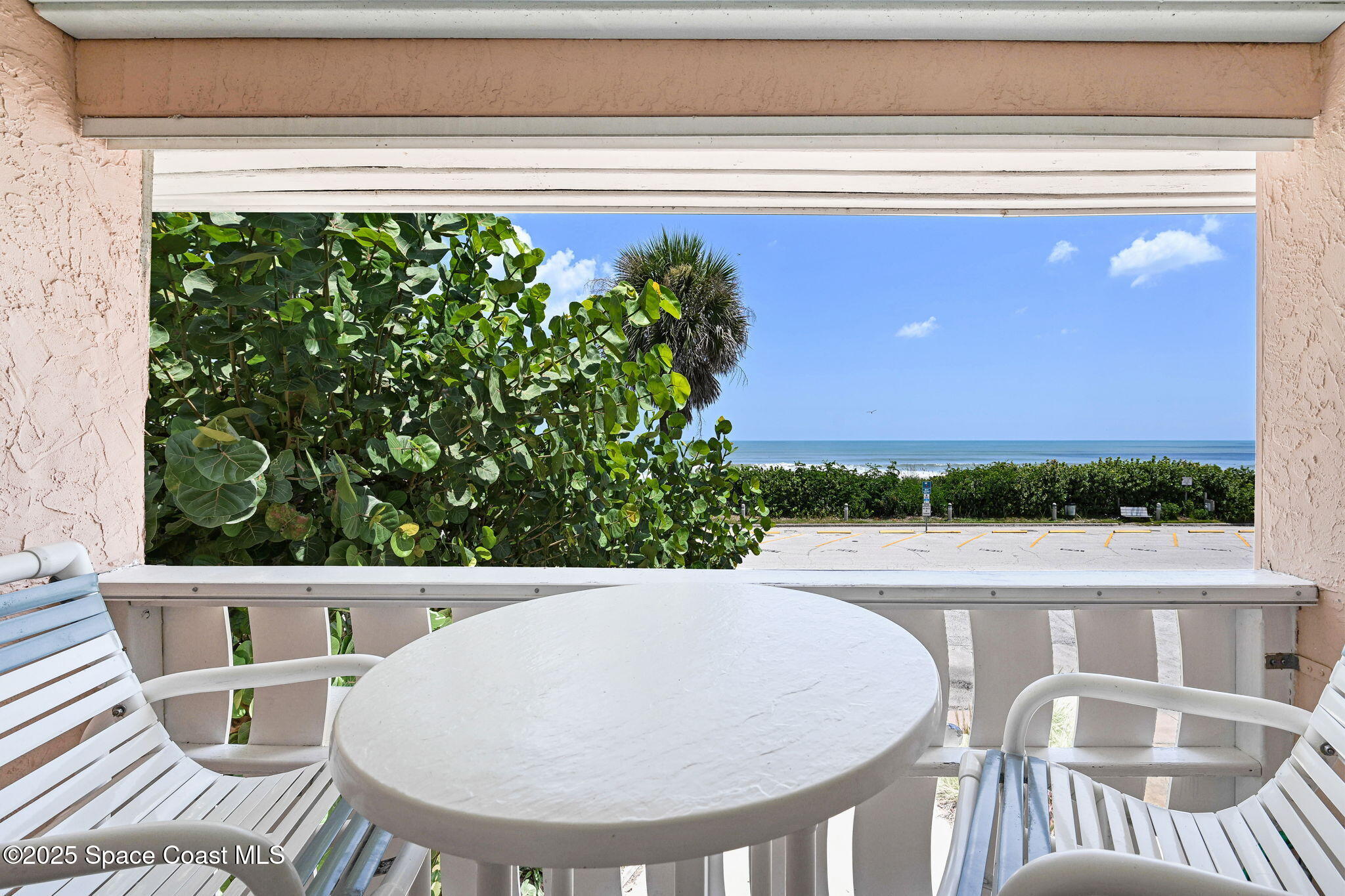 312 Wave Crest Avenue Indialantic, FL 32903 - Photo 44 of 62 a view of a chair and table in the balcony