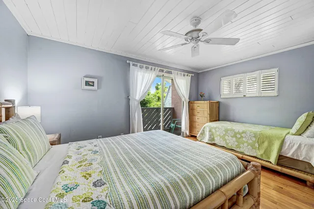 an aerial view of a house with a yard and lake view