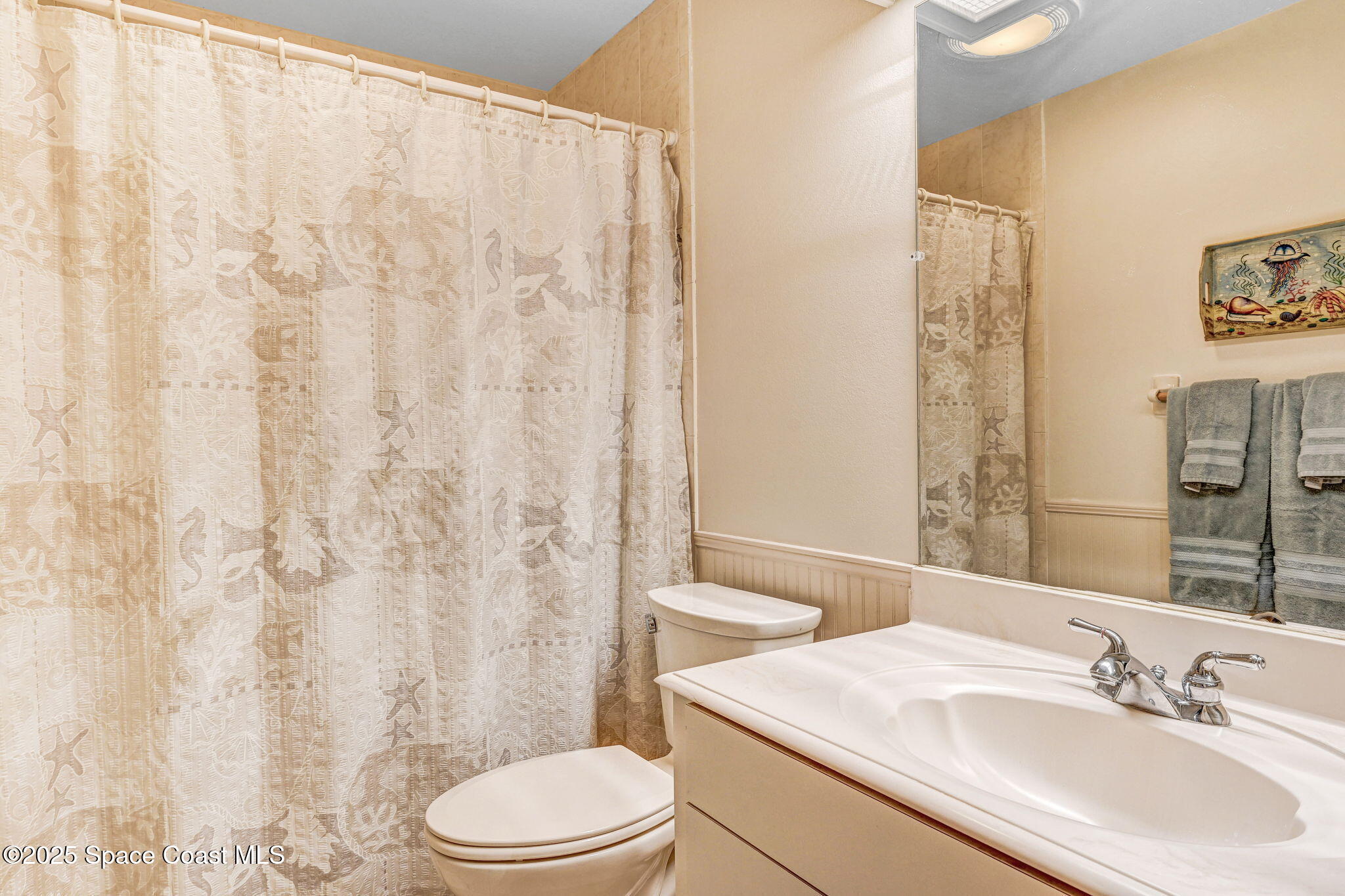 312 Wave Crest Avenue Indialantic, FL 32903 - Photo 50 of 62 a bathroom with a sink toilet and shower