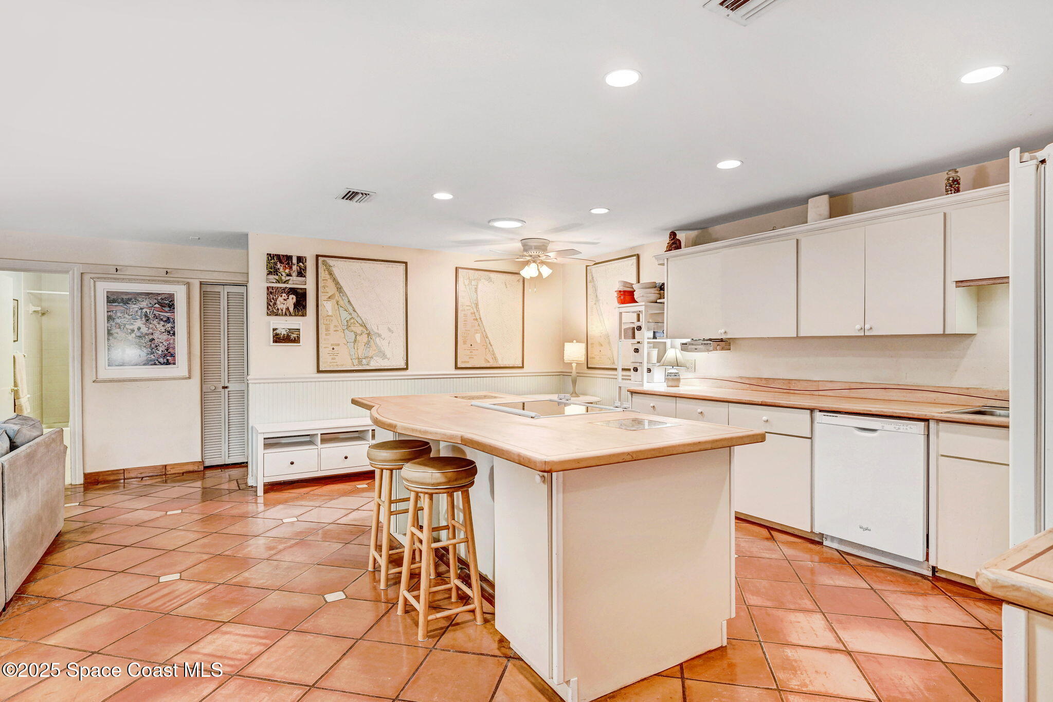 312 Wave Crest Avenue Indialantic, FL 32903 - Photo 6 of 62 a kitchen with stainless steel appliances granite countertop a sink and cabinets