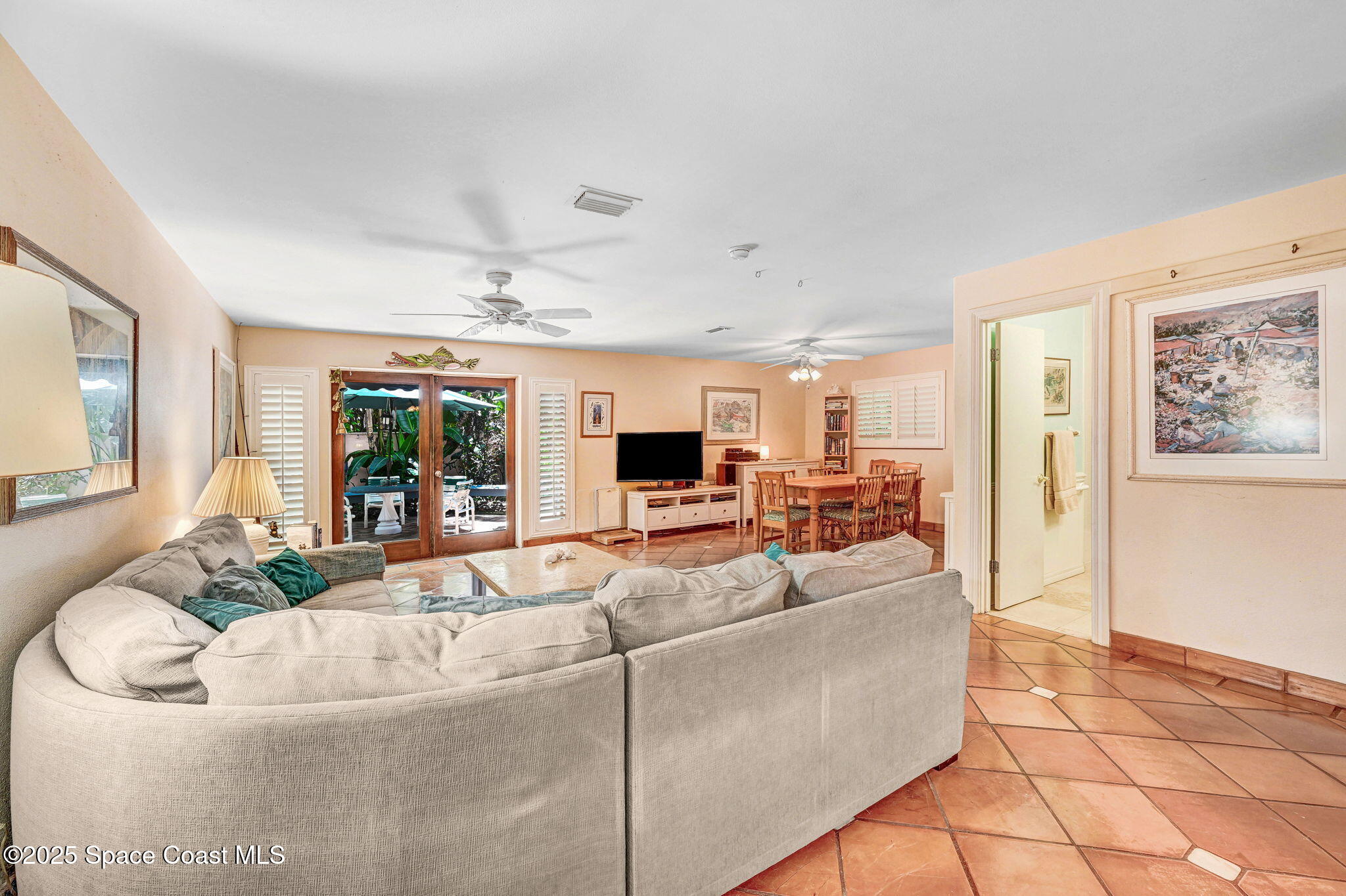 312 Wave Crest Avenue Indialantic, FL 32903 - Photo 8 of 62 a living room with furniture and a flat screen tv