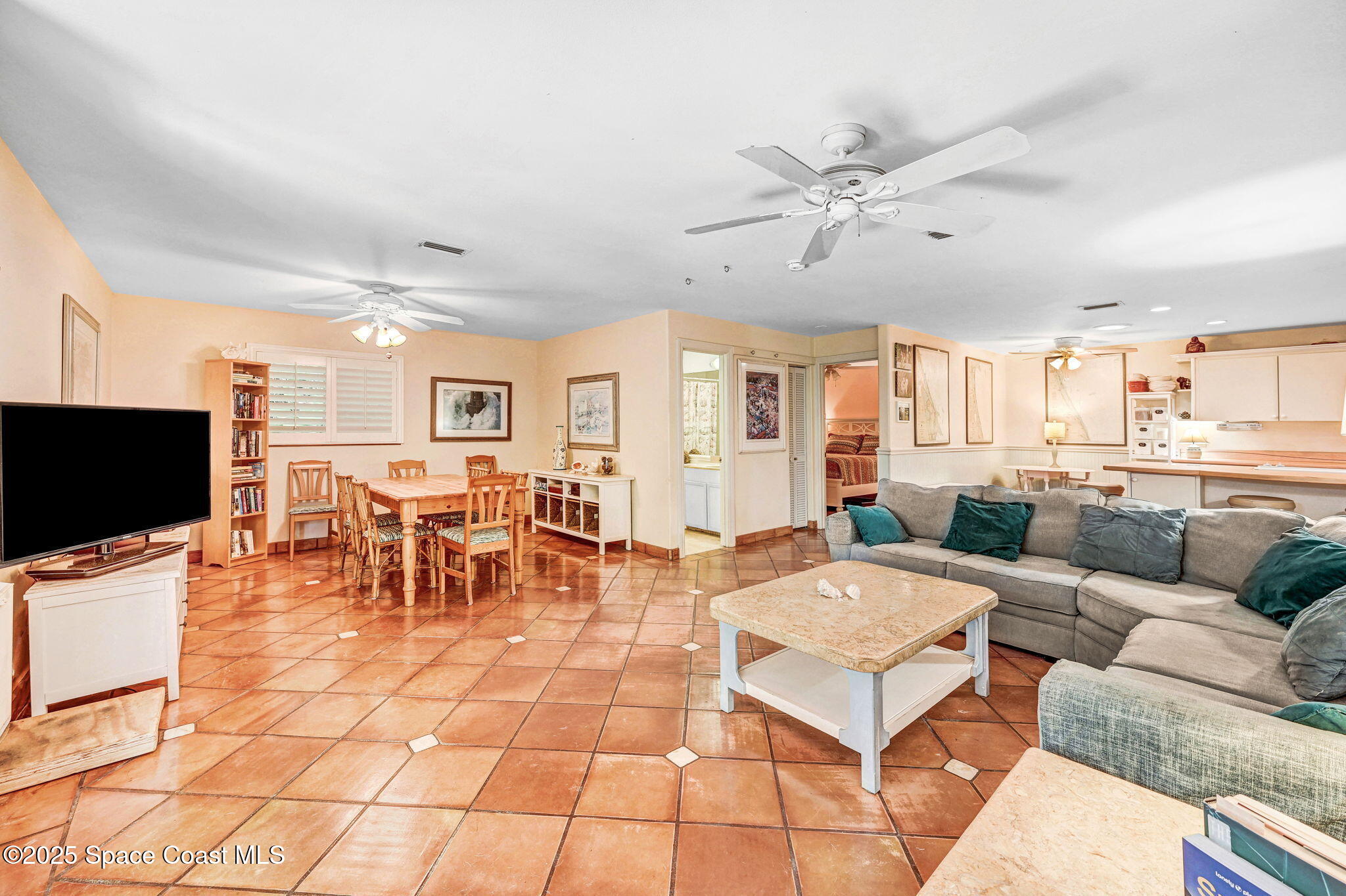 312 Wave Crest Avenue Indialantic, FL 32903 - Photo 9 of 62 a living room with furniture and a flat screen tv