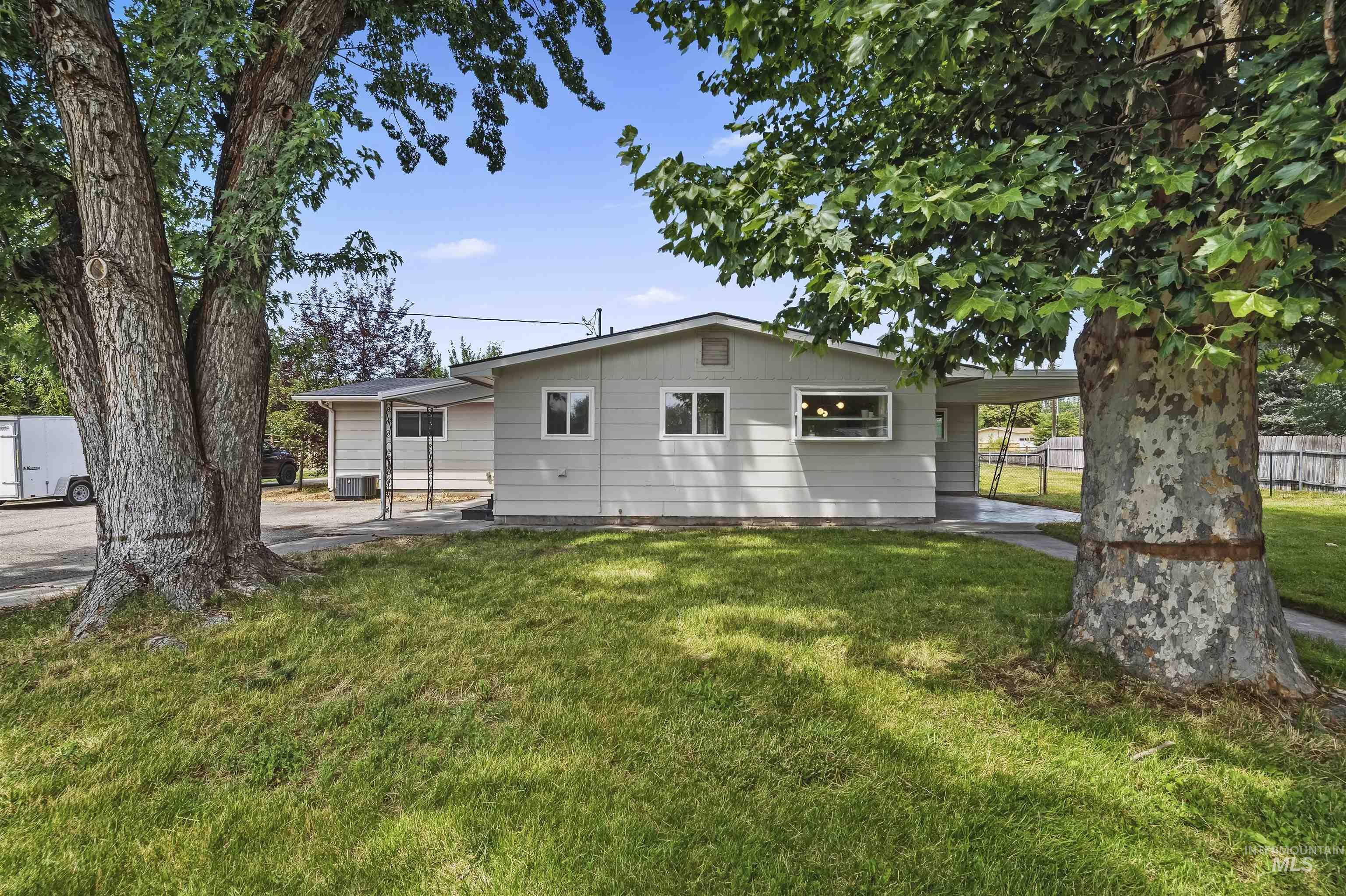 355 East Beacon Light Road Eagle, ID 83616 - Photo 26 of 47 Single-story residence featuring light gray siding and a low-pitch roofline