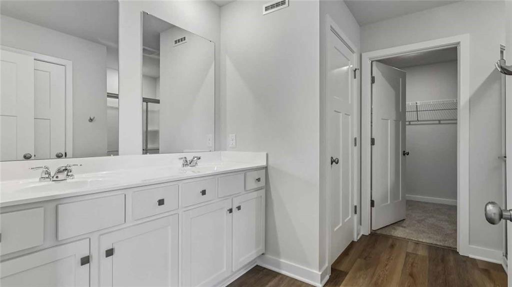 1099 Peachtree Road Carnegie, PA 15106 - Photo 9 of 25 a bathroom with a double vanity sink and mirror
