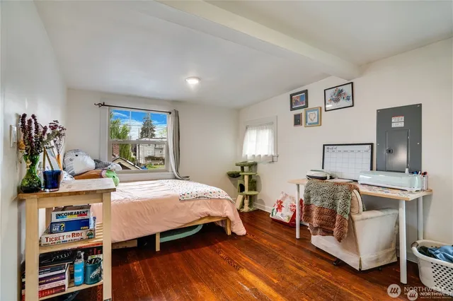 a bedroom with a bed and window