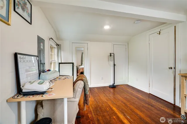 a bed room with a bed and a mirror