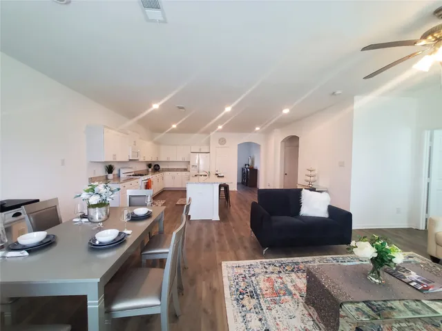 a living room with furniture and a table