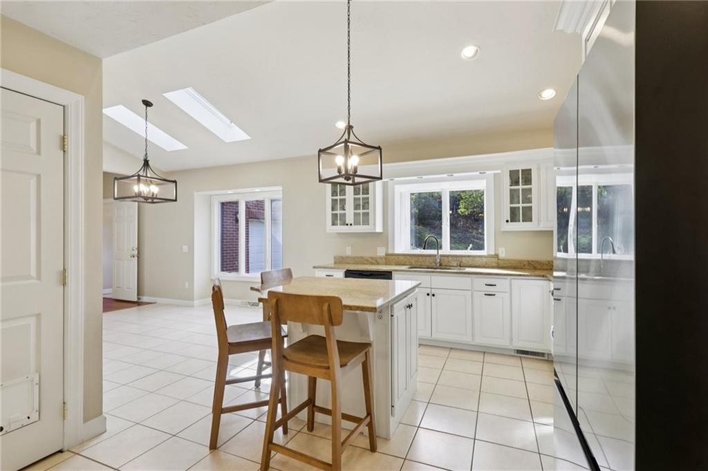4561 School Road South Export, PA 15632 - Photo 22 of 48 a kitchen with a sink a counter cabinets and appliances