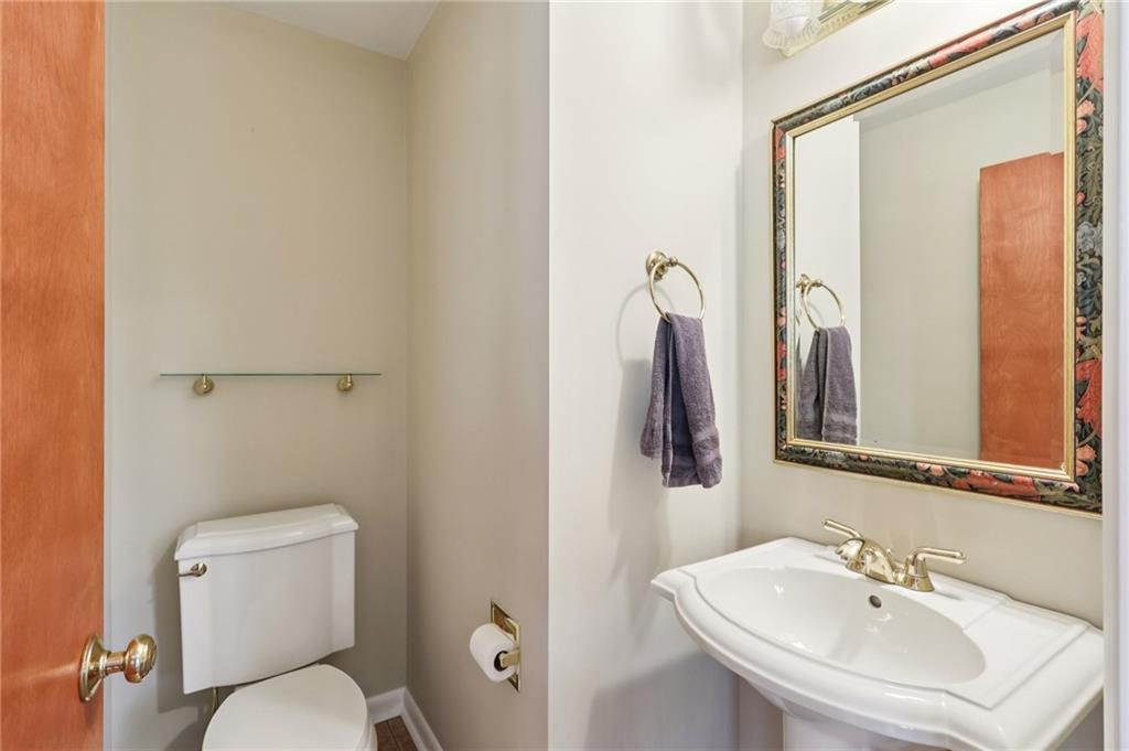 4561 School Road South Export, PA 15632 - Photo 31 of 48 a bathroom with a toilet a sink and mirror