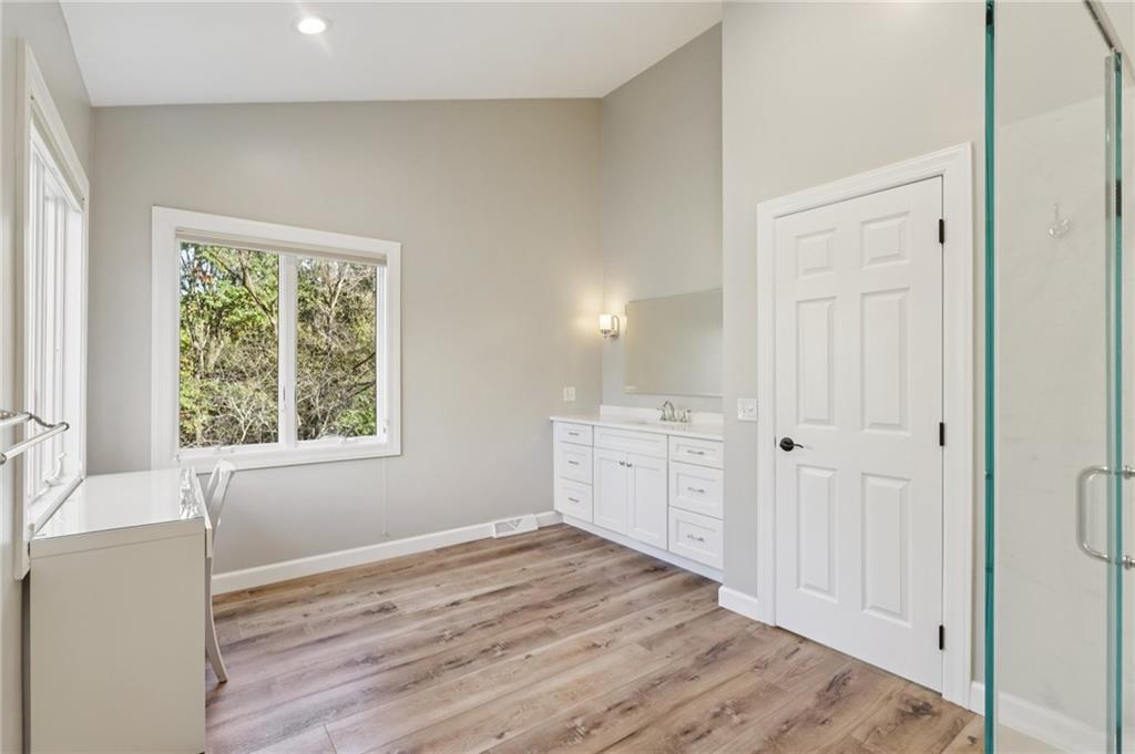 4561 School Road South Export, PA 15632 - Photo 32 of 48 a room with a bed and wooden floor