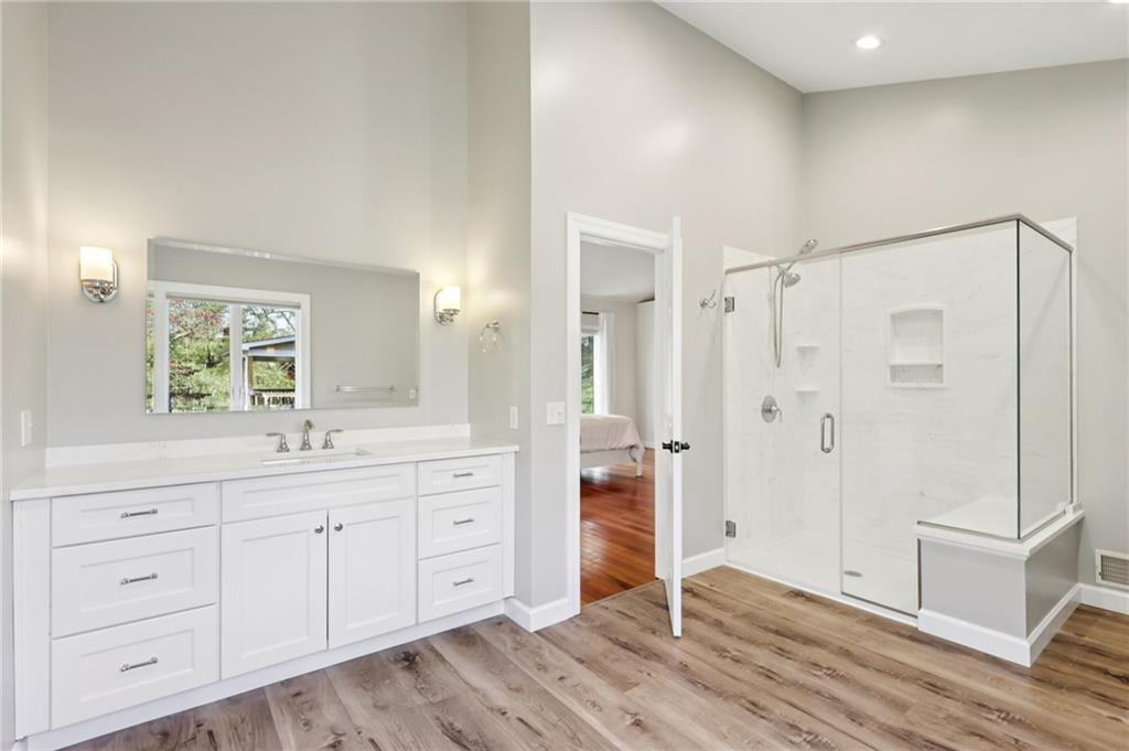 4561 School Road South Export, PA 15632 - Photo 34 of 48 a spacious bathroom with a granite countertop sink a mirror and a shower
