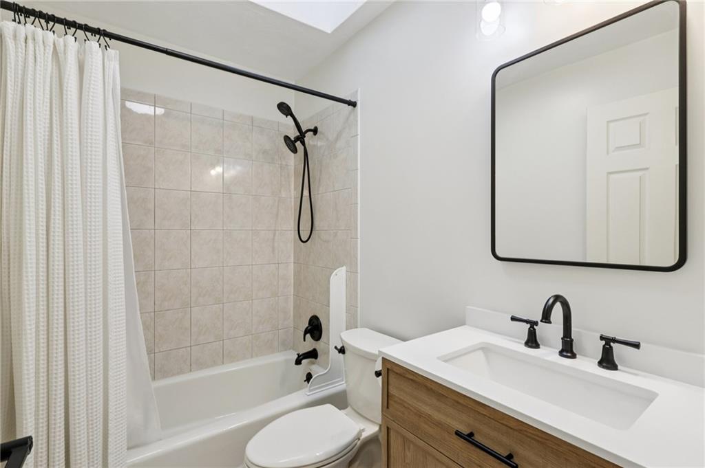 4561 School Road South Export, PA 15632 - Photo 35 of 48 a bathroom with a sink toilet tub and shower