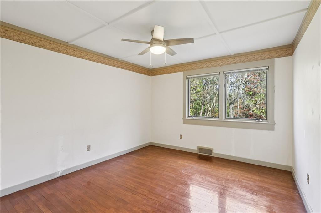4561 School Road South Export, PA 15632 - Photo 36 of 48 an empty room with a window and ceiling fan