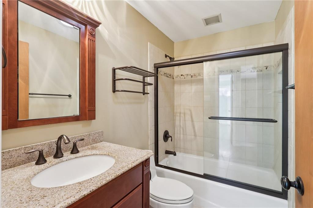 4561 School Road South Export, PA 15632 - Photo 42 of 48 a bathroom with a granite countertop sink toilet and shower