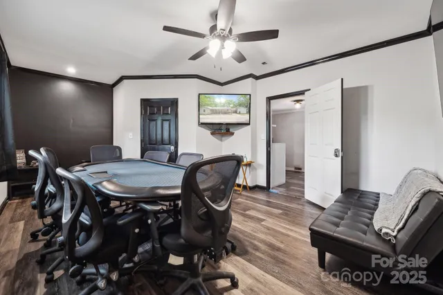 a view of a livingroom with furniture and a dining table