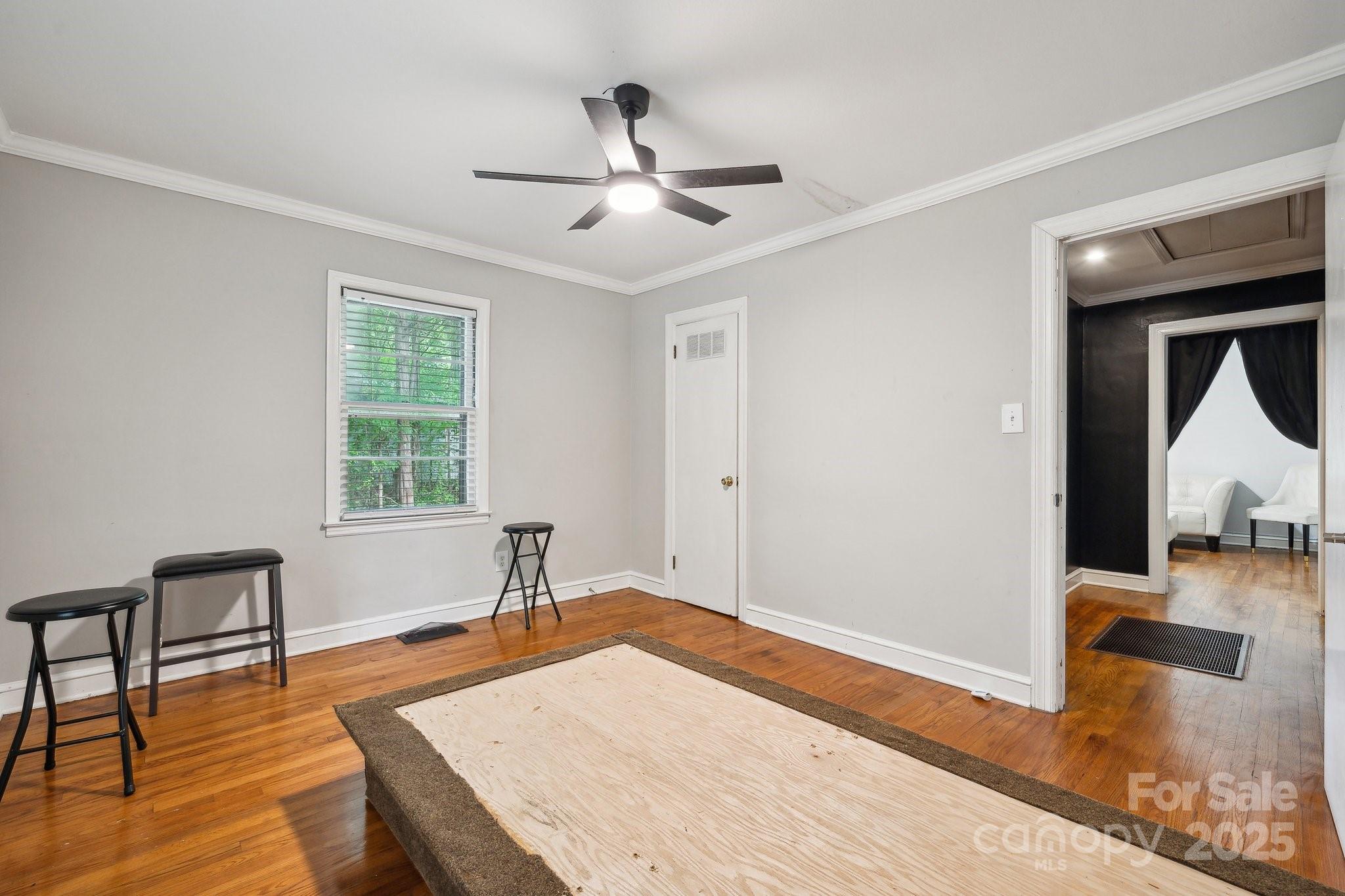 1917 Tom Sadler Road Charlotte, NC 28214 - Photo 16 of 27 a bedroom with a bed and furniture