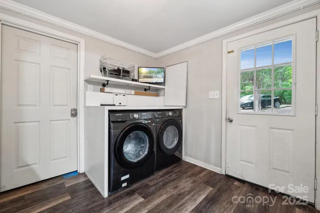 a utility room with closet dryer and washer